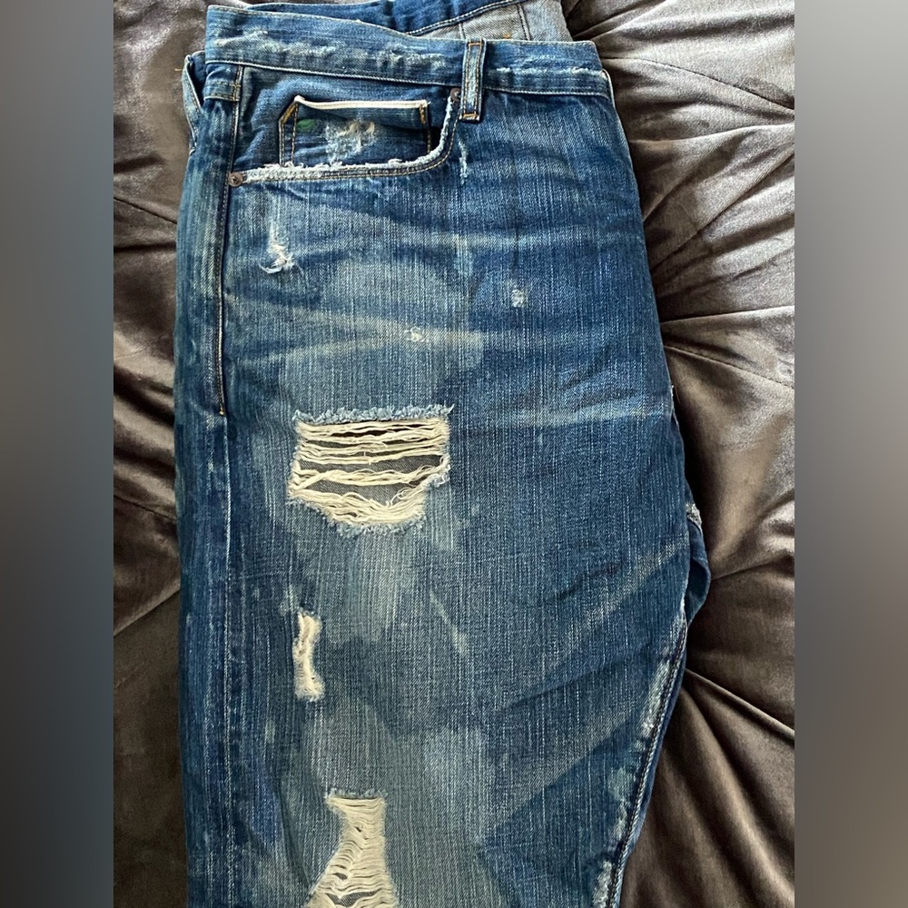 Tattered acid washed jeans